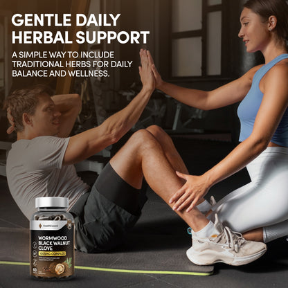 Person with healthy digestion using HealthEssent Wormwood Black Walnut Clove supplement - natural gut support with 6-in-1 synergistic formula for digestive balance and intestinal wellness