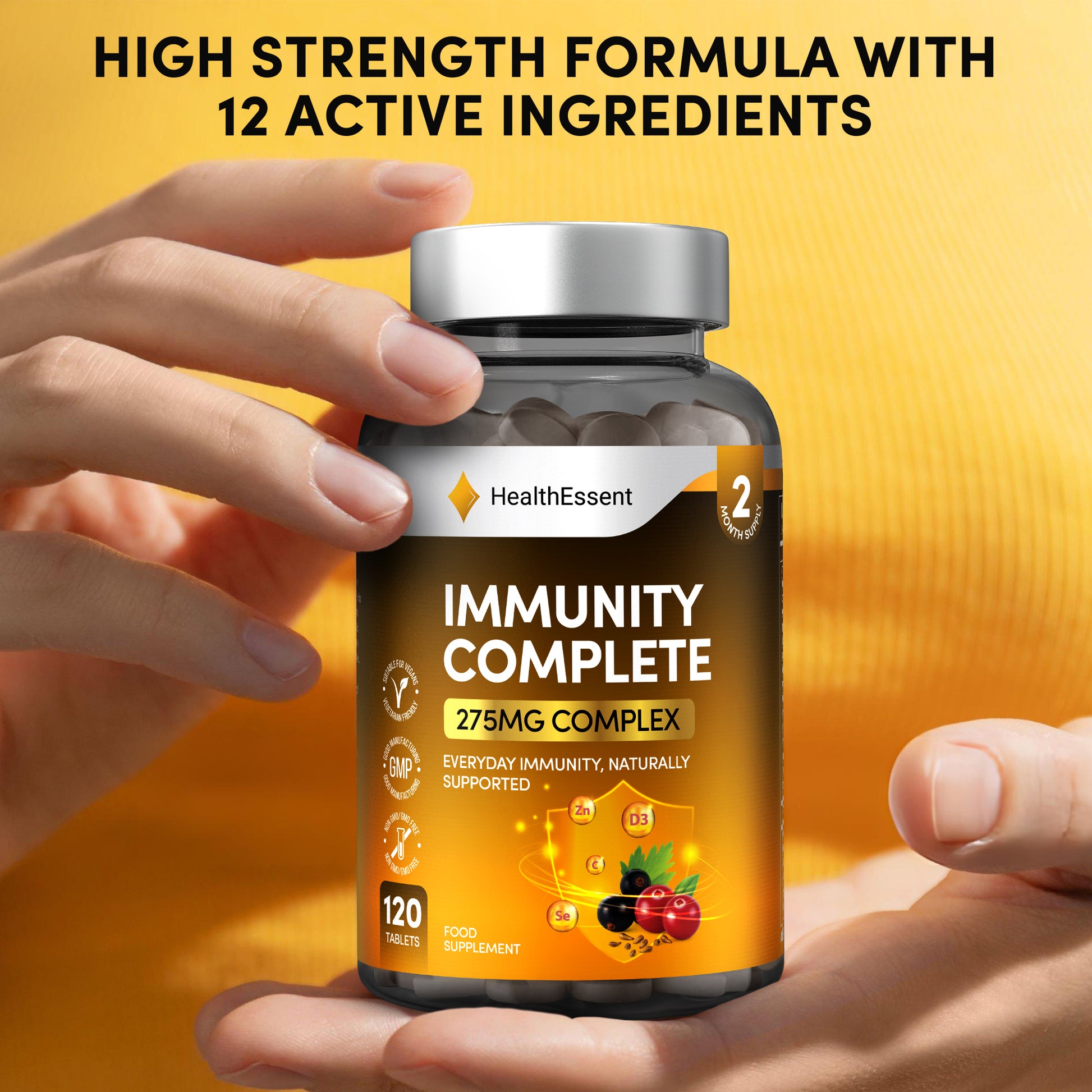 Hands holding HealthEssent Immunity Complete supplement bottle - stay protected naturally with 10 powerful immune-boosting ingredients including elderberry, vitamin C, D3, and zinc